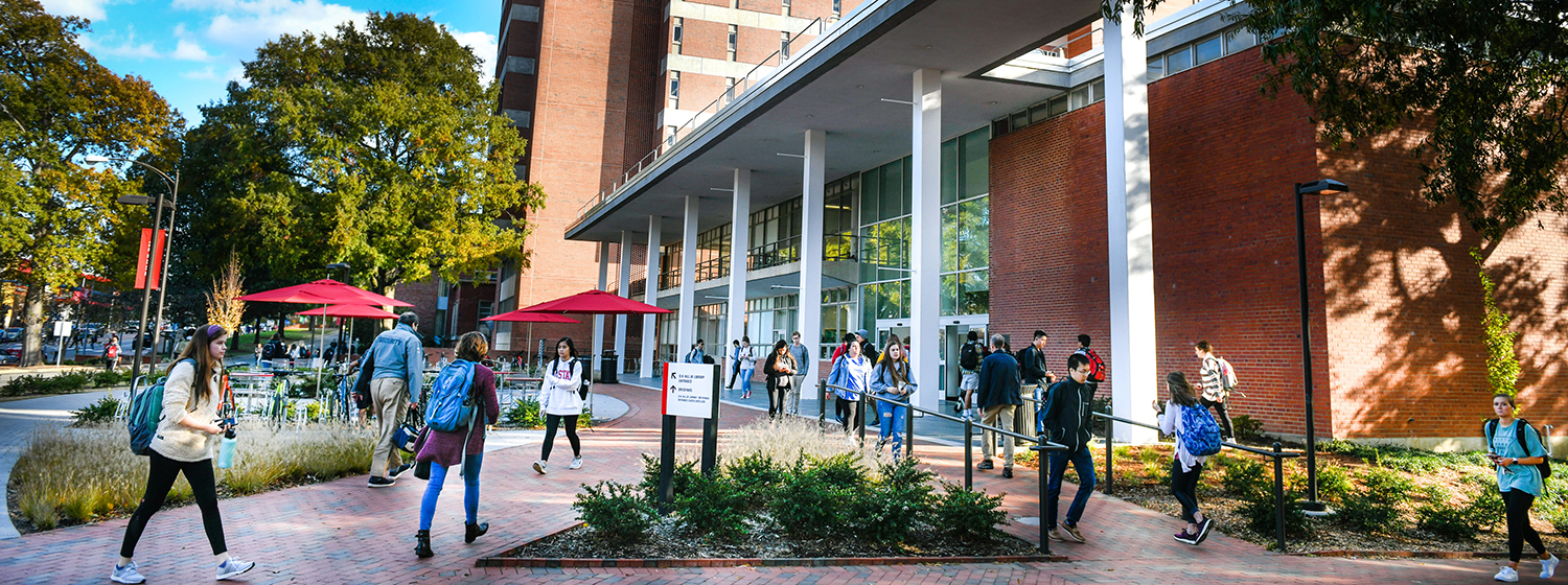 students on nc state campus outside DH Hill lIbrary