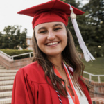 Alumna Julia Koehler in her graduation robes.