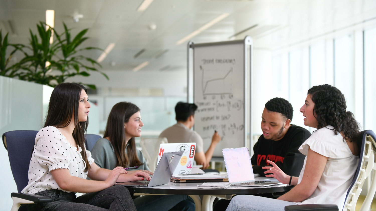 Group of NC State students studying at Hunt Library