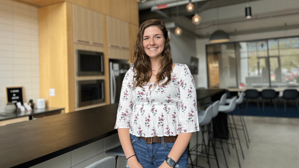 Jaclyn McVey stands in a community space on campus.